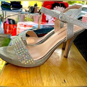 Silver high heels with gems in the front. Size 8. Worn once.